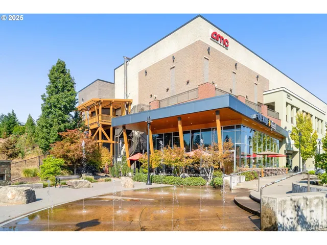 en empty room with window and wooden floor