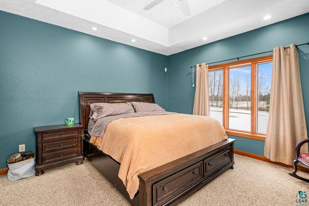 2542 Ziehl Road Carlton, MN 55718 - Photo 23 of 51 Bedroom featuring light carpet, a textured ceiling, ceiling fan, and recessed lighting