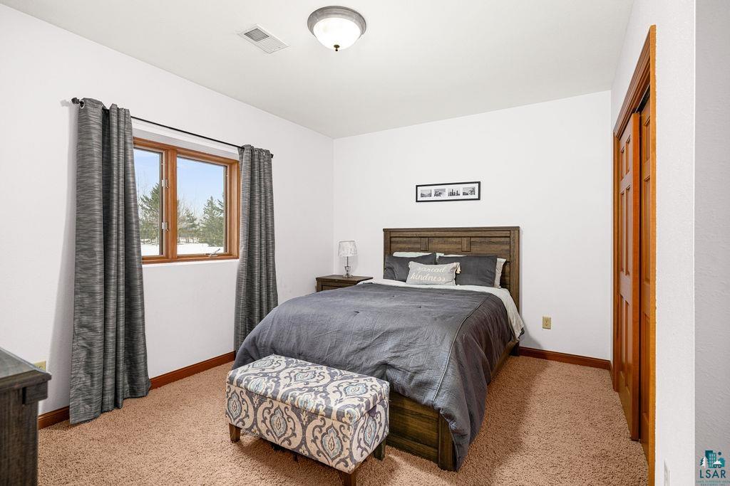 2542 Ziehl Road Carlton, MN 55718 - Photo 37 of 51 Bedroom with light colored carpet