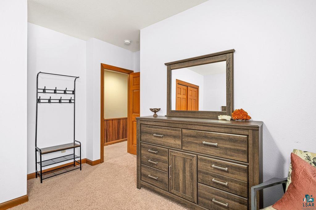 2542 Ziehl Road Carlton, MN 55718 - Photo 38 of 51 Hall with light colored carpet and baseboards