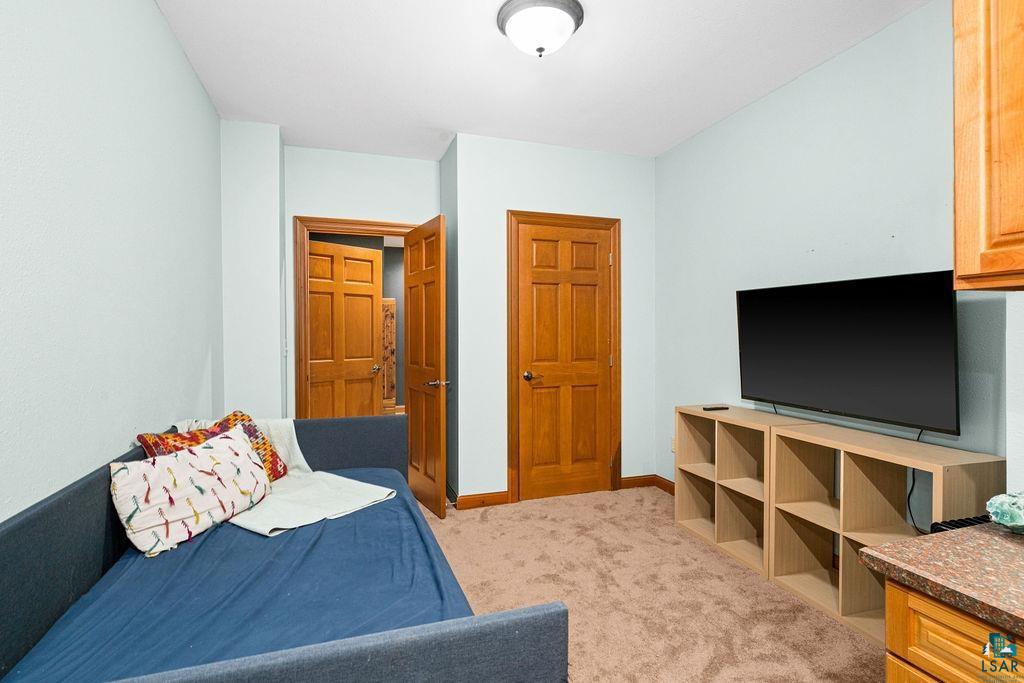 2542 Ziehl Road Carlton, MN 55718 - Photo 42 of 51 Bedroom featuring light carpet and baseboards