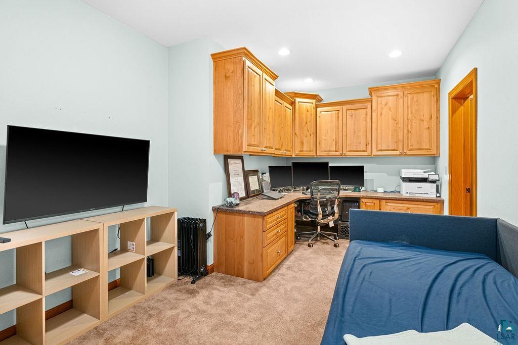 2542 Ziehl Road Carlton, MN 55718 - Photo 43 of 51 Home office featuring built in study area, light colored carpet, radiator, and recessed lighting