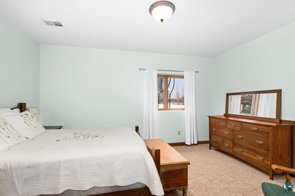 2542 Ziehl Road Carlton, MN 55718 - Photo 45 of 51 Bedroom featuring light carpet and baseboards