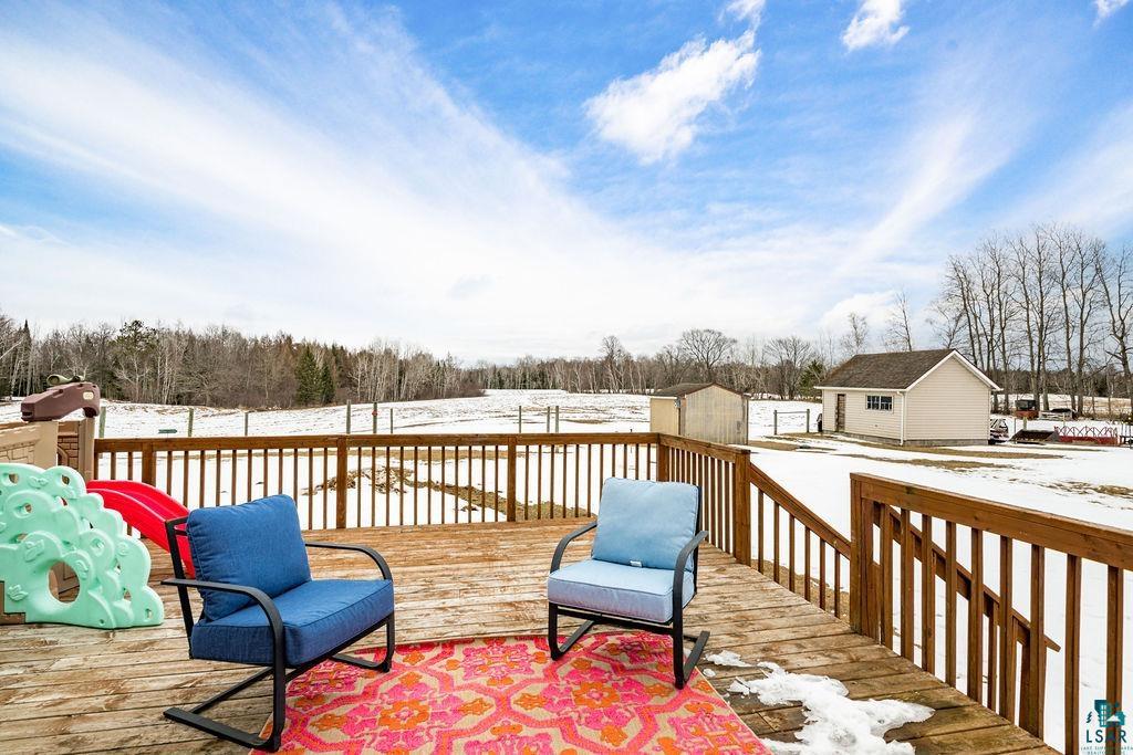 2542 Ziehl Road Carlton, MN 55718 - Photo 7 of 51 Snow covered deck with a storage unit
