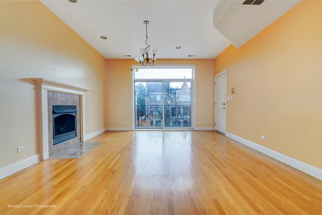 a view of kitchen with wooden floor and electronic appliances