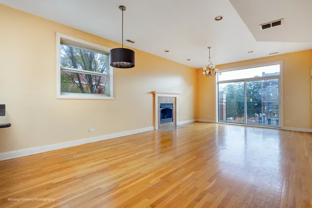 a kitchen with stainless steel appliances granite countertop a refrigerator a sink and a stove