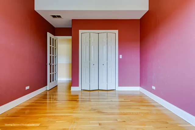 a view of a room with a ceiling fan