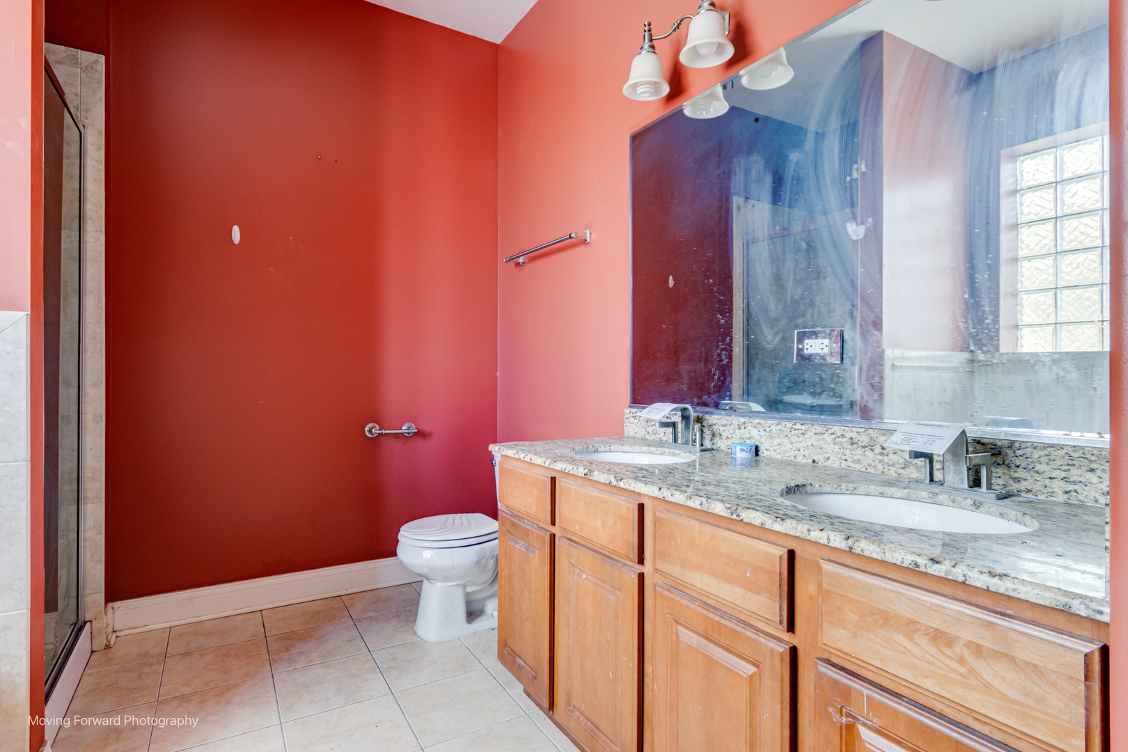 4900 South Vincennes Avenue, Unit 3 Chicago, IL 60615 - Photo 25 of 27 a bathroom with a granite countertop sink mirror vanity and toilet
