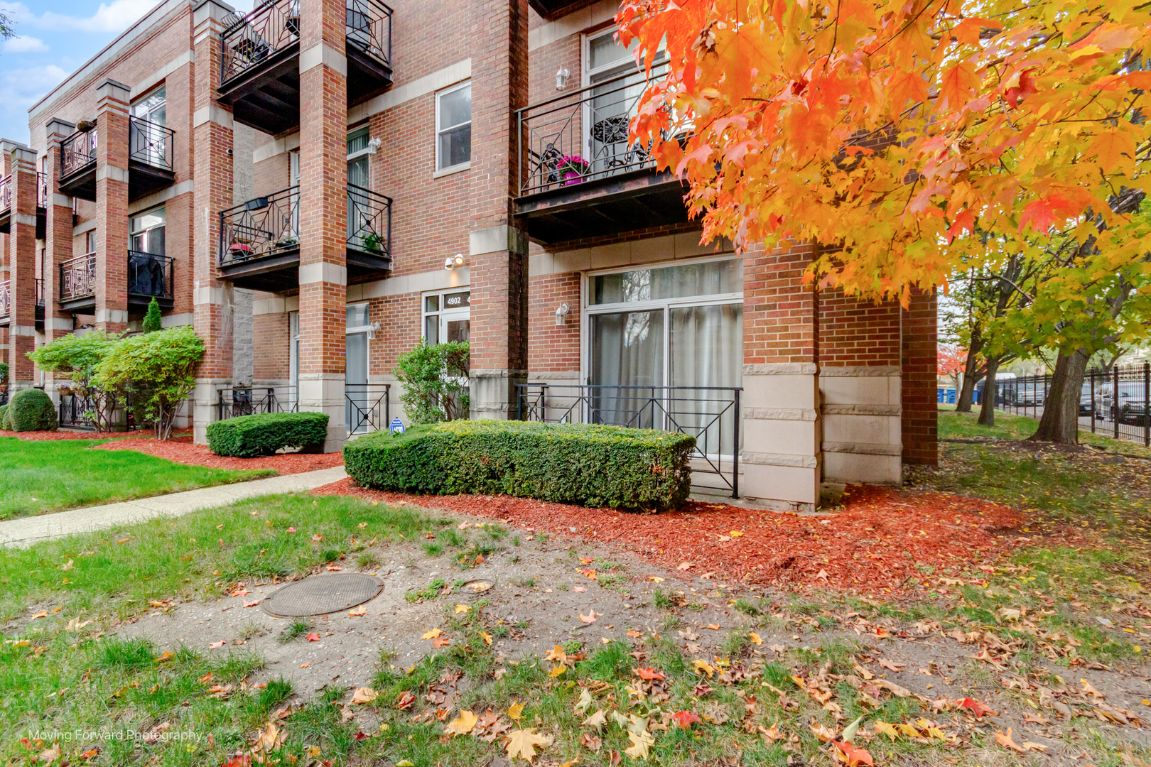 4900 South Vincennes Avenue, Unit 3 Chicago, IL 60615 - Photo 9 of 27 a view of a house with a small yard and large tree