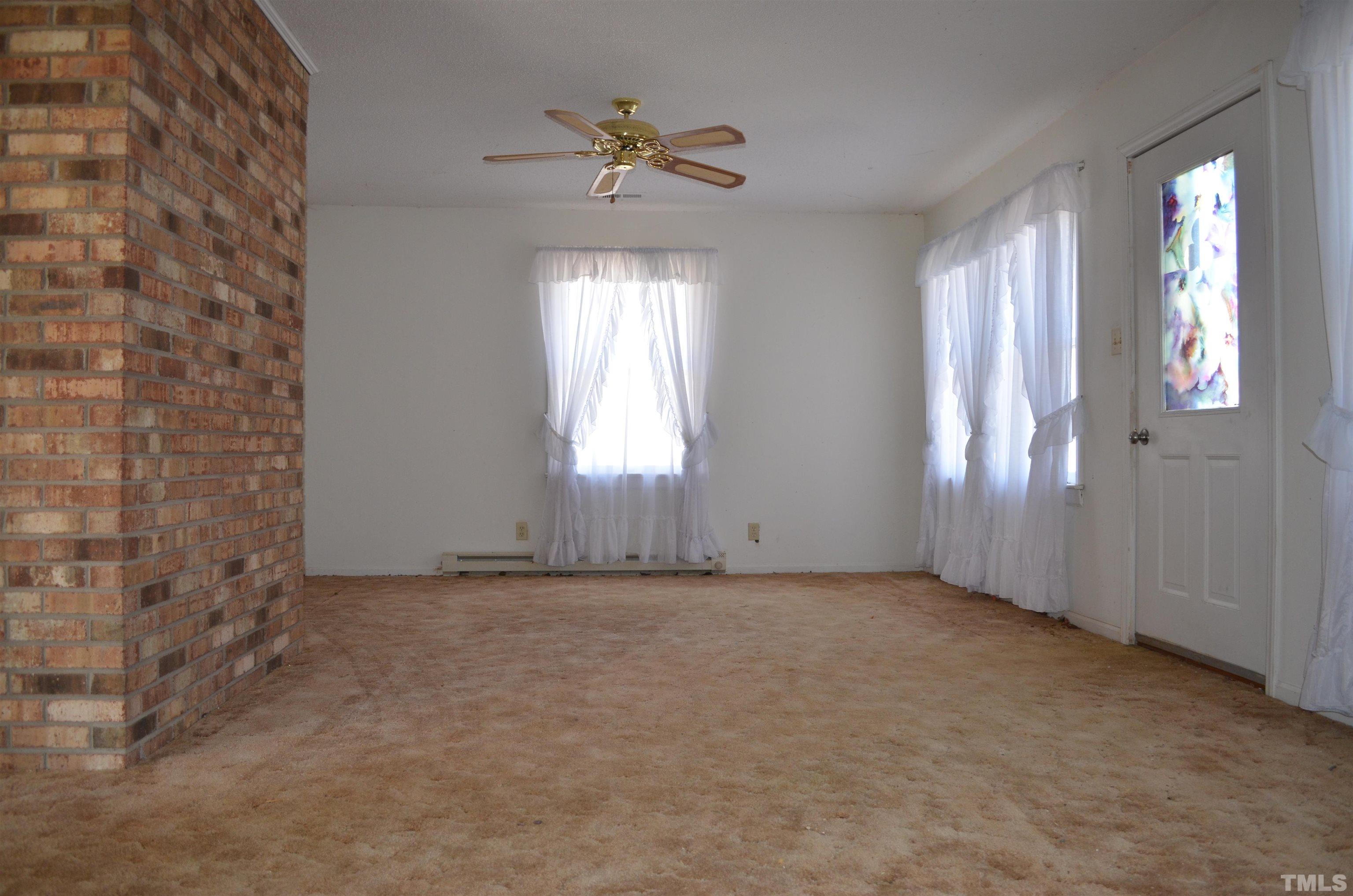 123 Joe Brown Road Bear Creek, NC 27207 - Photo 11 of 32 a view of an empty room with a window