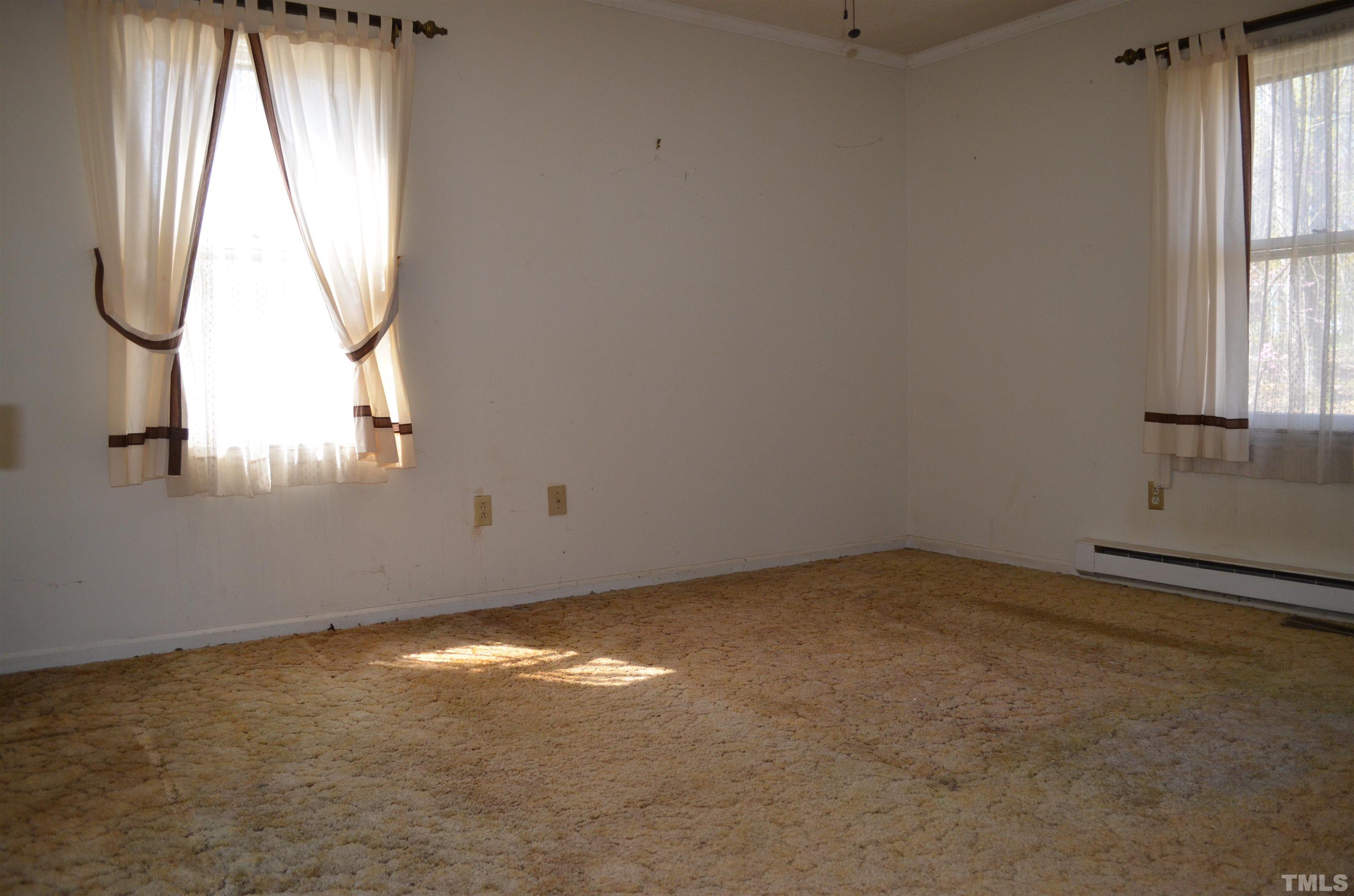 123 Joe Brown Road Bear Creek, NC 27207 - Photo 15 of 32 an empty room with windows