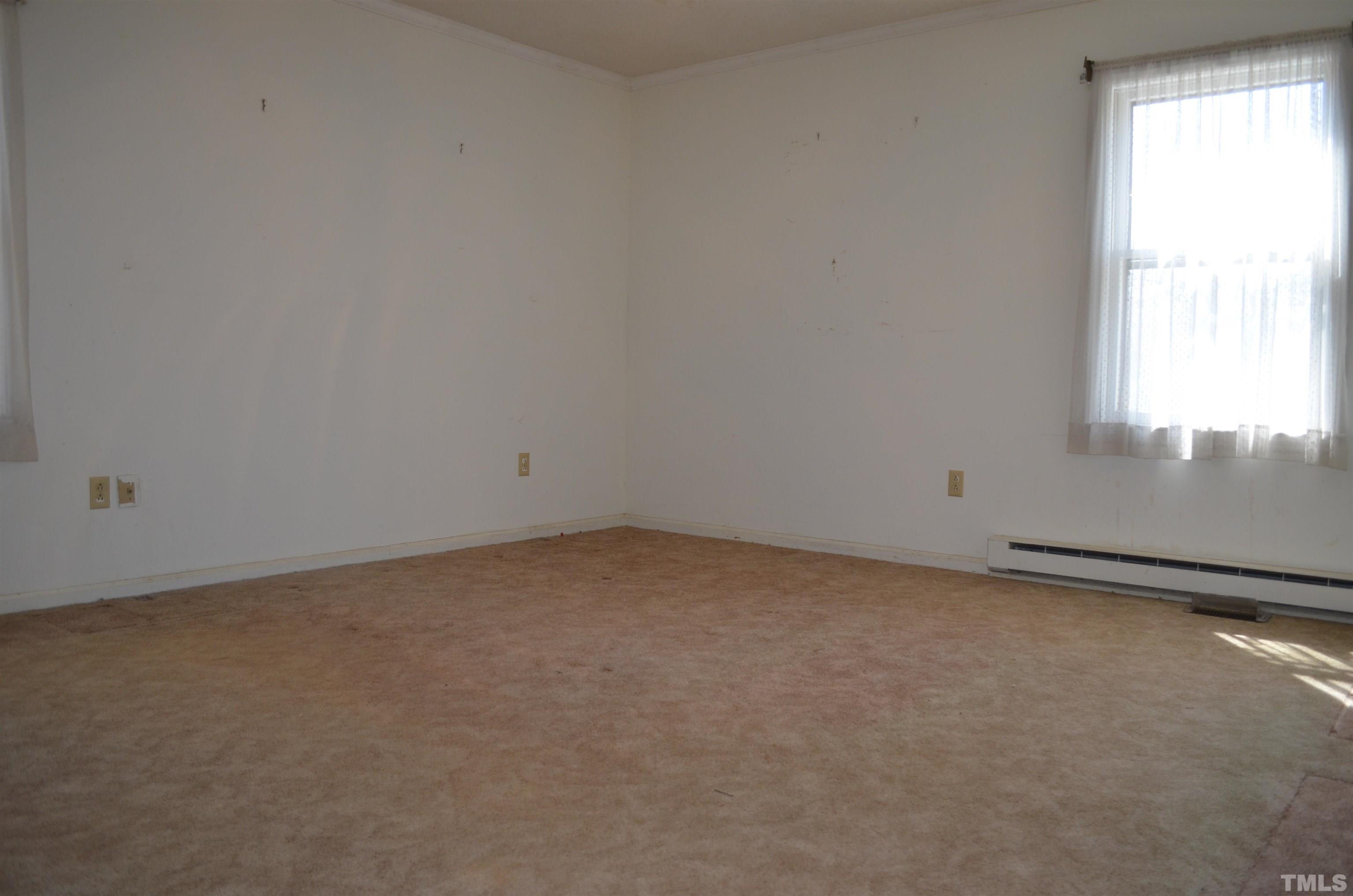 123 Joe Brown Road Bear Creek, NC 27207 - Photo 16 of 32 an empty room with a window