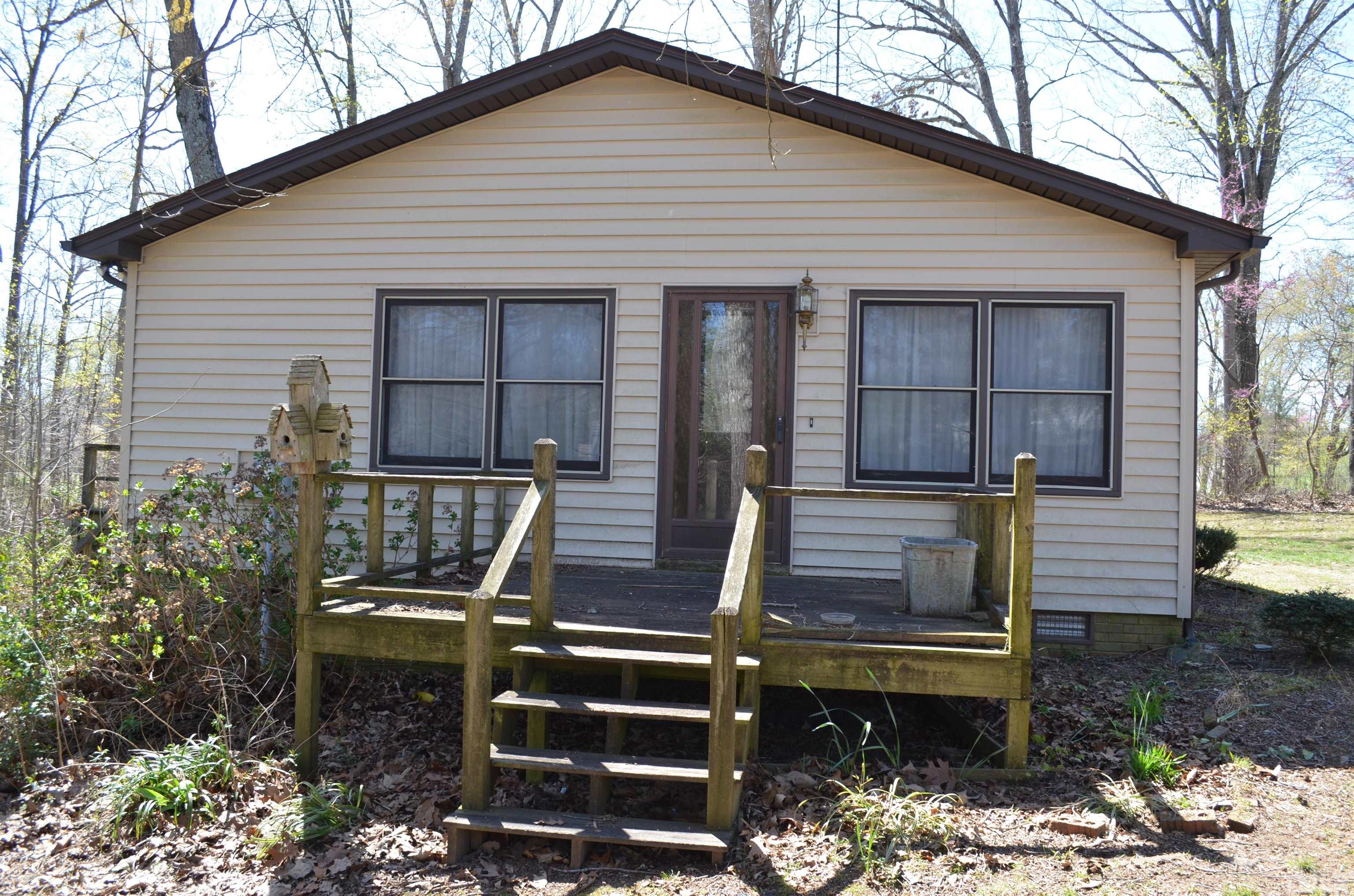 123 Joe Brown Road Bear Creek, NC 27207 - Photo 26 of 32 a view of a chairs setting in the backyard
