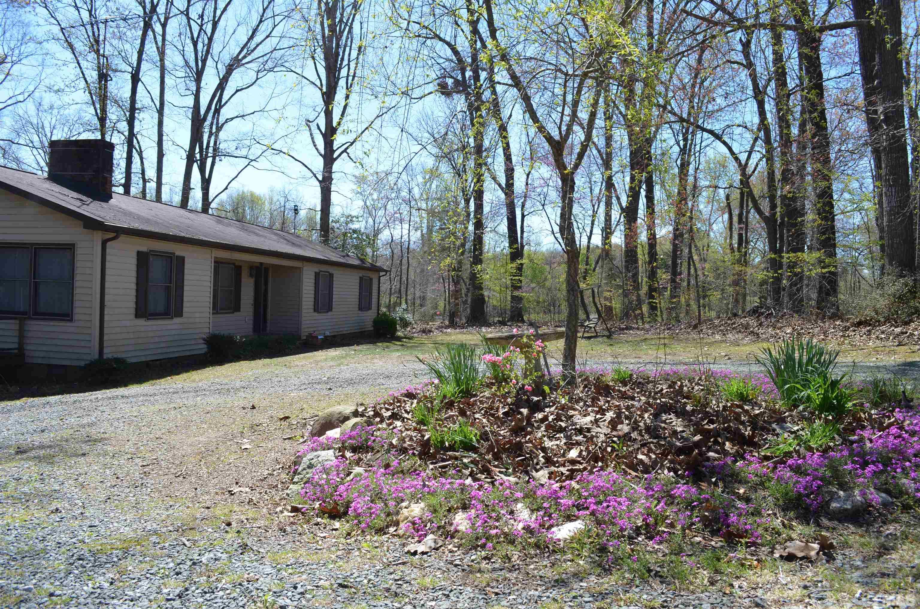 123 Joe Brown Road Bear Creek, NC 27207 - Photo 29 of 32 a front view of a house with a yard