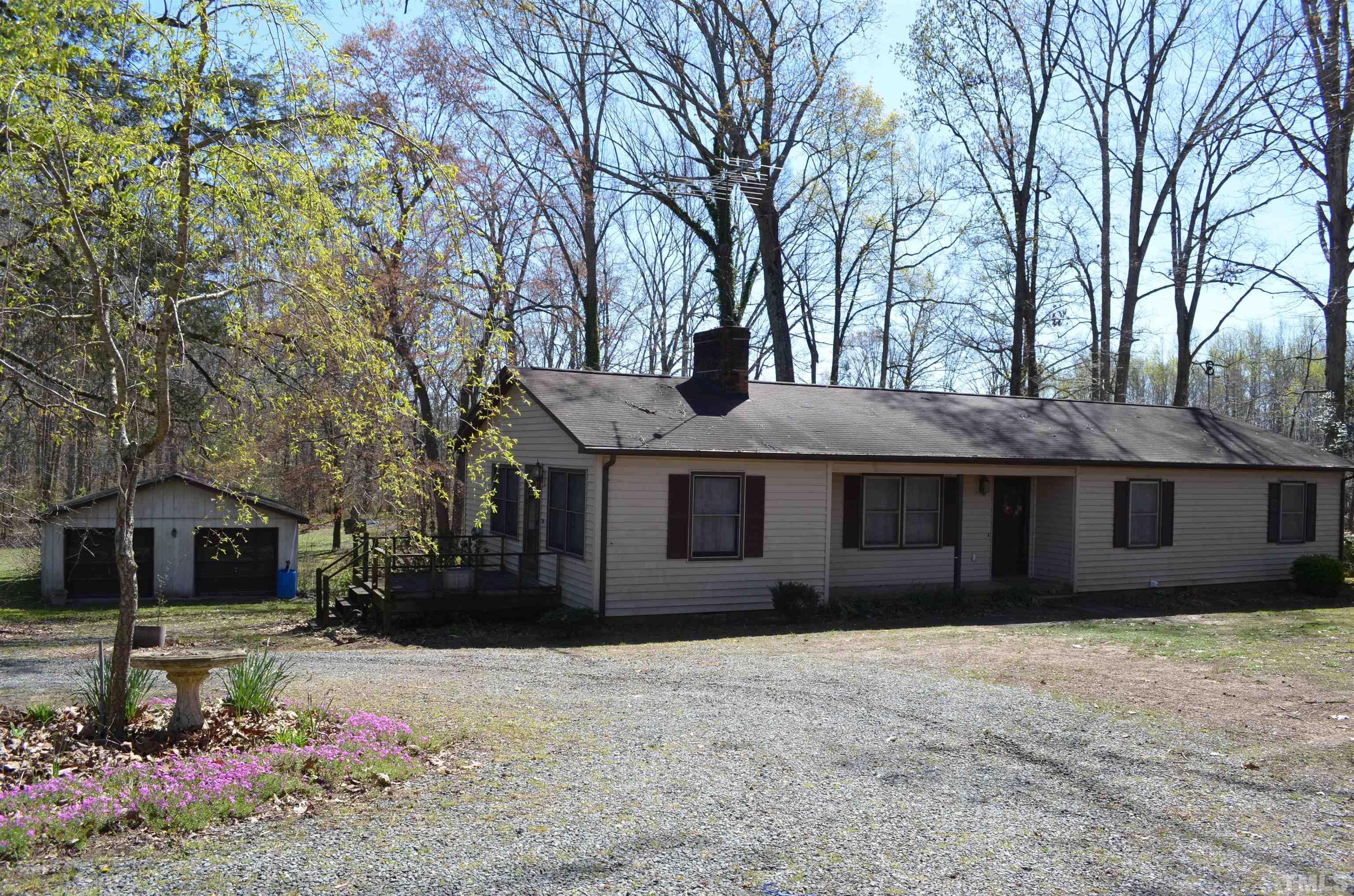 123 Joe Brown Road Bear Creek, NC 27207 - Photo 3 of 32 a house view with a garden space