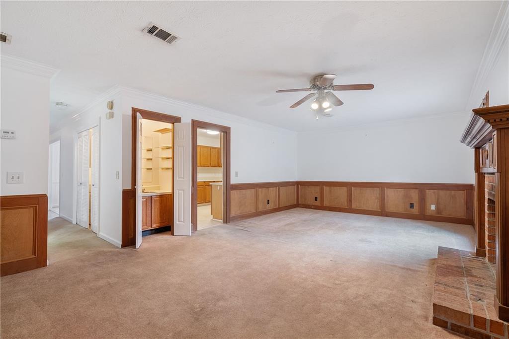 3278 Hampton Green Way Atlanta, GA 30340 - Photo 14 of 28 an empty room with chandelier fan and windows