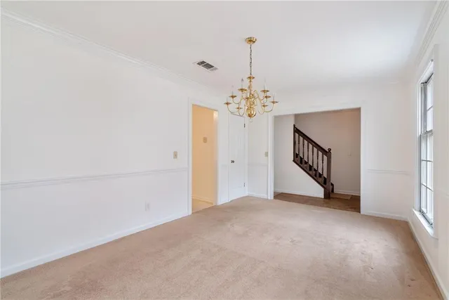 a view of a livingroom with a staircase