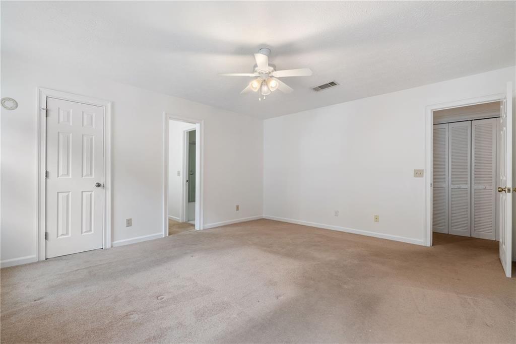 3278 Hampton Green Way Atlanta, GA 30340 - Photo 17 of 28 an empty room with fan and entryway