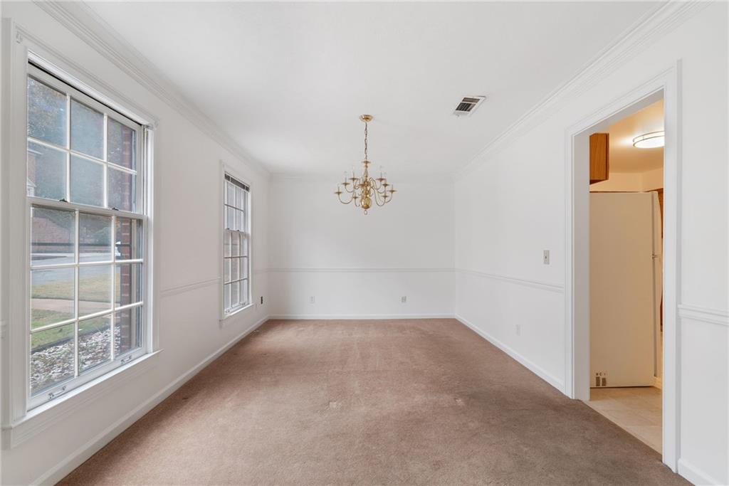 3278 Hampton Green Way Atlanta, GA 30340 - Photo 6 of 28 an empty room with windows