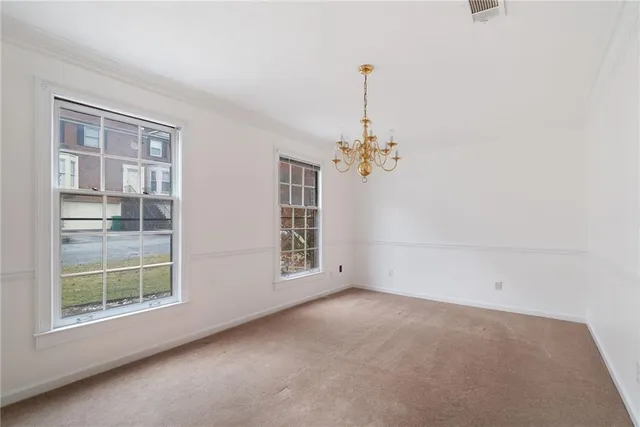 a view of empty room with windows