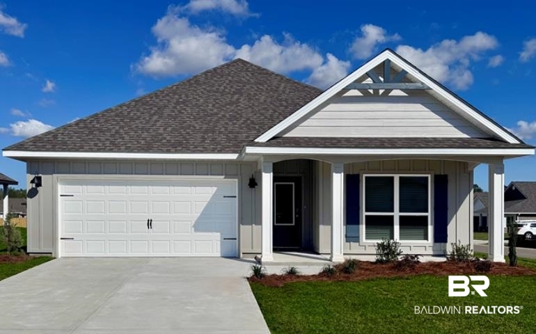 21238 Teluga Avenue Fairhope, AL 36532 - Photo 1 of 30 Single story home with an attached garage, a front yard, a shingled roof, a porch, and driveway