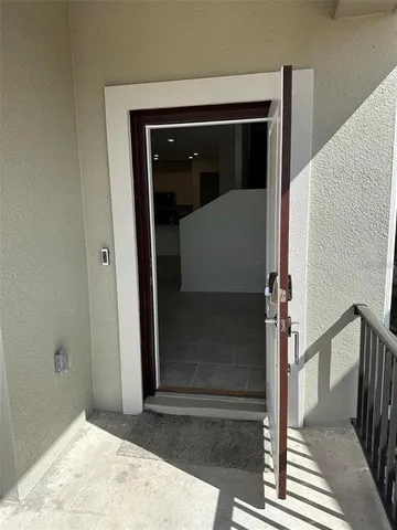 a view of a wooden door of the house