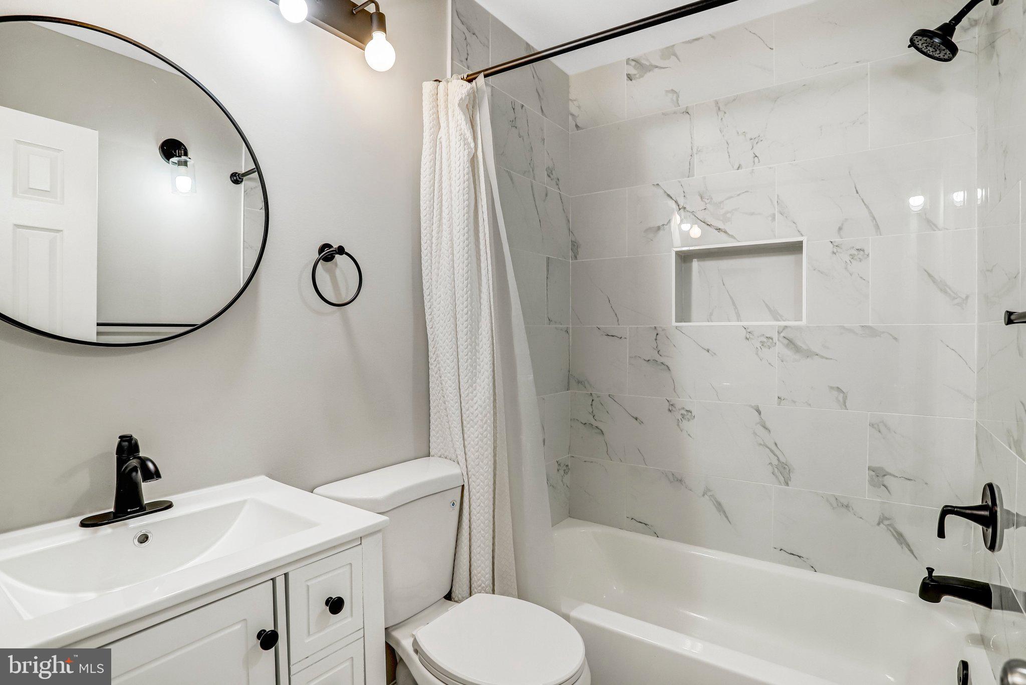 2807 Strauss Terrace Silver Spring, MD 20904 - Photo 19 of 26 a bathroom with a sink toilet and shower