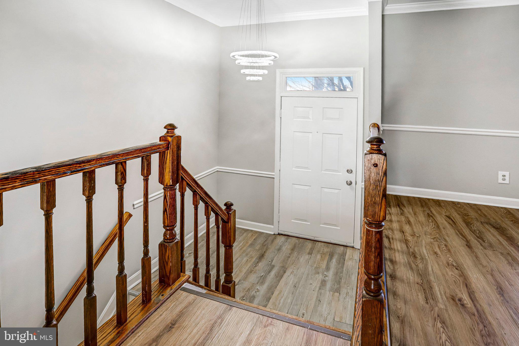 2807 Strauss Terrace Silver Spring, MD 20904 - Photo 2 of 26 a view of a hallway with wooden floor and staircase