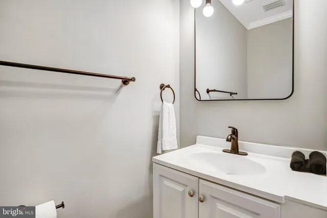 a bathroom with a sink and mirror