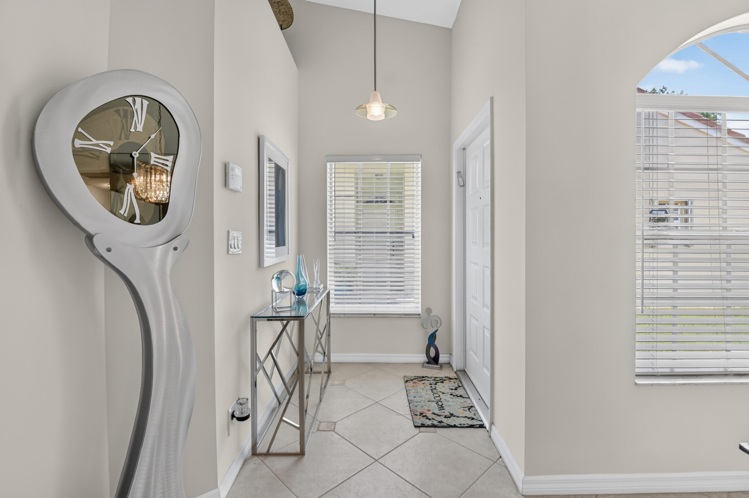 15340 Floral Club Road Delray Beach, FL 33484 - Photo 4 of 42 a view of a hallway with washer and dryer