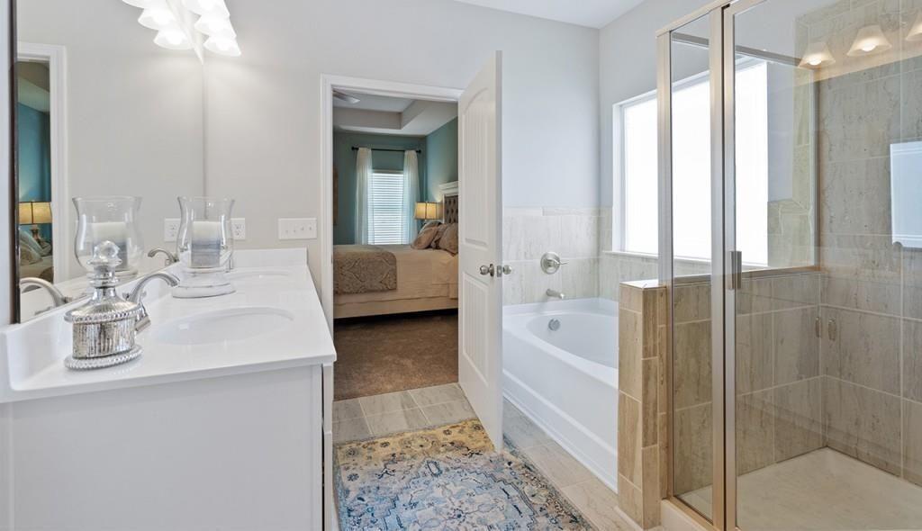 118 Sycamore Lane Calhoun, GA 30701 - Photo 14 of 19 a en suite bathroom with a double vanity sink a mirror and a shower