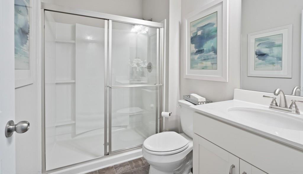 118 Sycamore Lane Calhoun, GA 30701 - Photo 4 of 19 a bathroom with a granite countertop sink toilet and shower