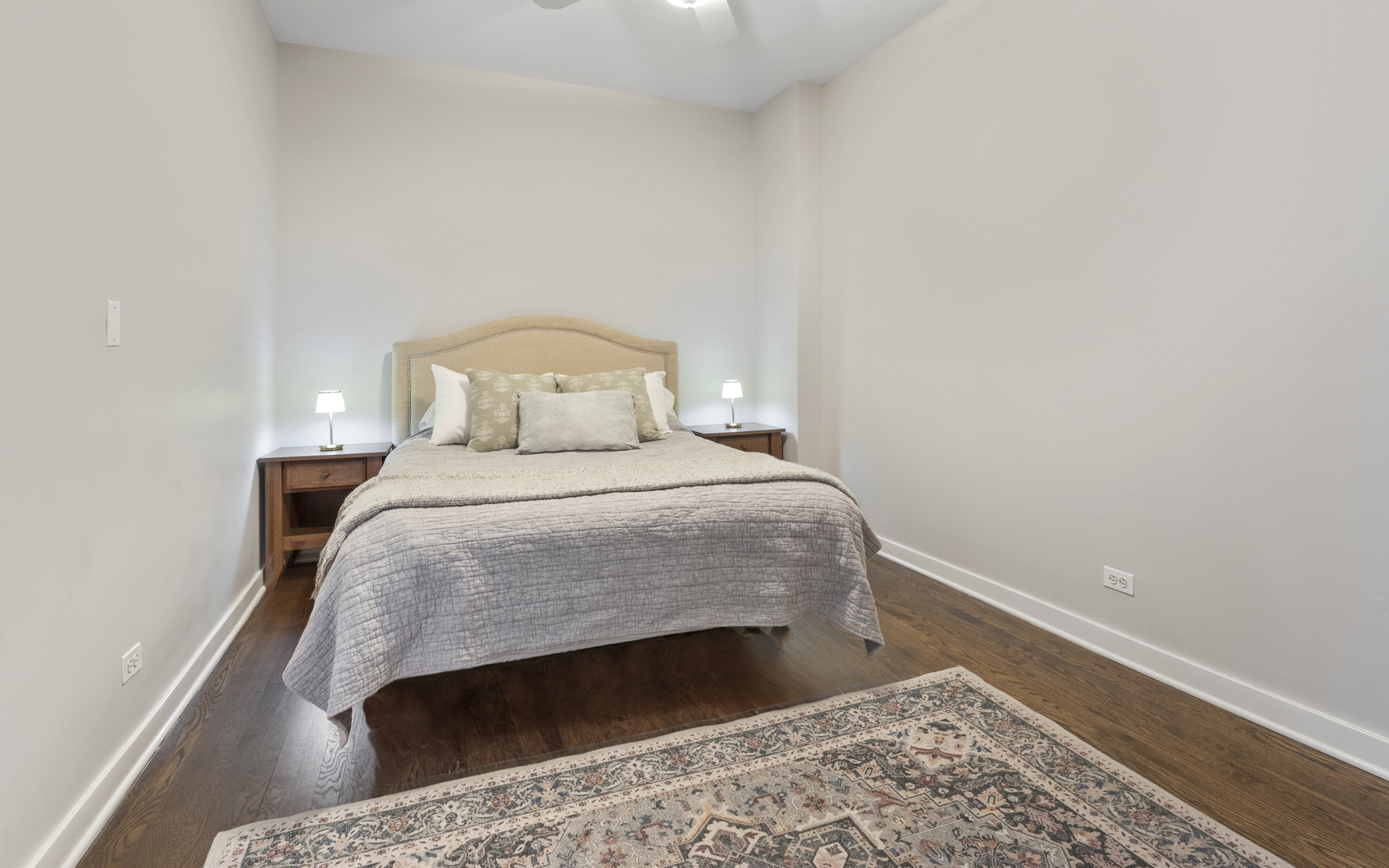 1214 West Webster Avenue, Unit 2E Chicago, IL 60614 - Photo 15 of 23 a bedroom with a bed and a rug