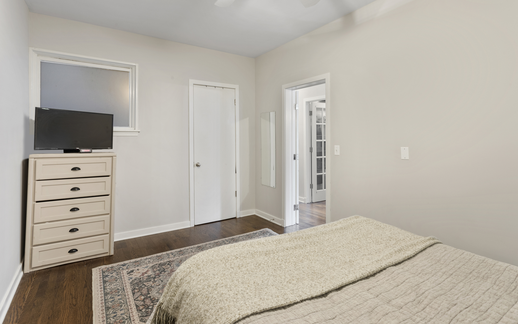 1214 West Webster Avenue, Unit 2E Chicago, IL 60614 - Photo 16 of 23 a bedroom with a bed and a flat screen tv