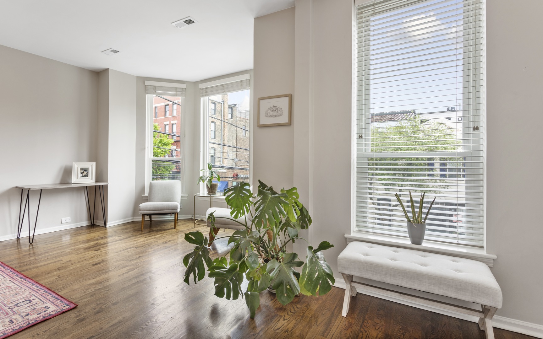 1214 West Webster Avenue, Unit 2E Chicago, IL 60614 - Photo 2 of 23 a living room with furniture and a potted plant
