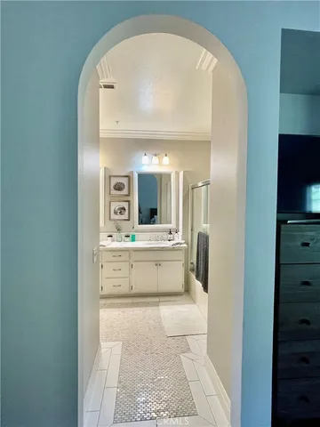 a view of living room with flat screen tv and refrigerator