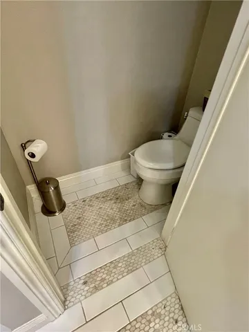 a bathroom with a toilet and a sink