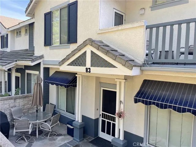 a view of a house with entryway and wooden floor