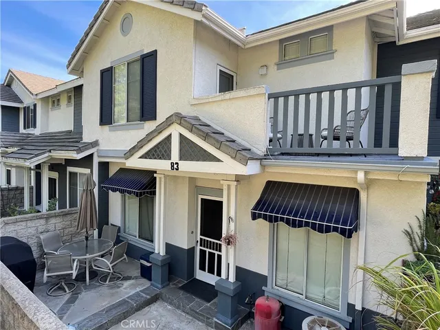 a view of a house with wooden floor and a large window