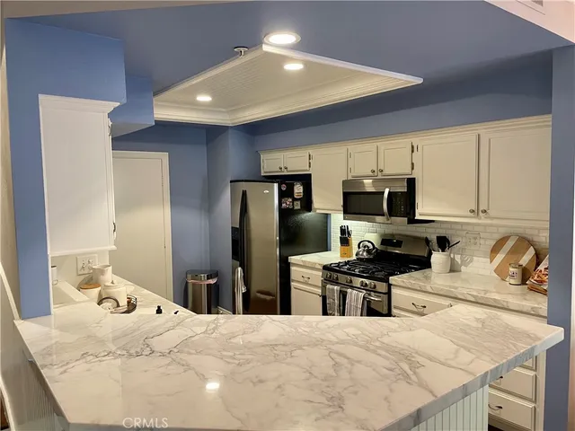 a bedroom with a bed and furniture