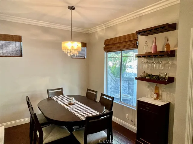 a view of a dining room with furniture and window