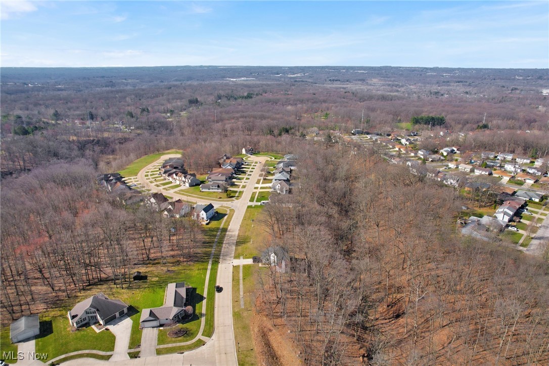 6372 Valley Ranch Drive Maple Heights, OH 44137 - Photo 8 of 9 Drone / aerial view featuring a wooded view