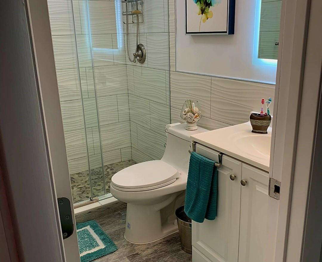 300 Duck Key Drive, Unit 6 Marathon, FL 33050 - Photo 17 of 32 a bathroom with a sink toilet and shower