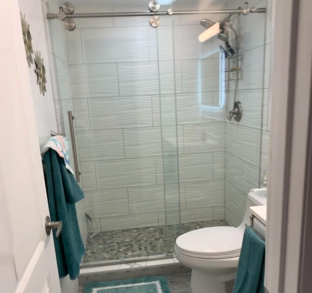 300 Duck Key Drive, Unit 6 Marathon, FL 33050 - Photo 18 of 32 a bathroom with a toilet and a shower