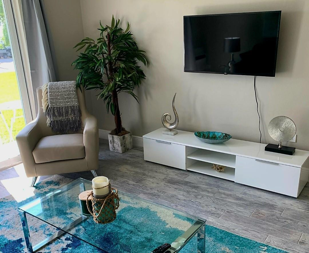 300 Duck Key Drive, Unit 6 Marathon, FL 33050 - Photo 9 of 32 a living room with furniture and a flat screen tv