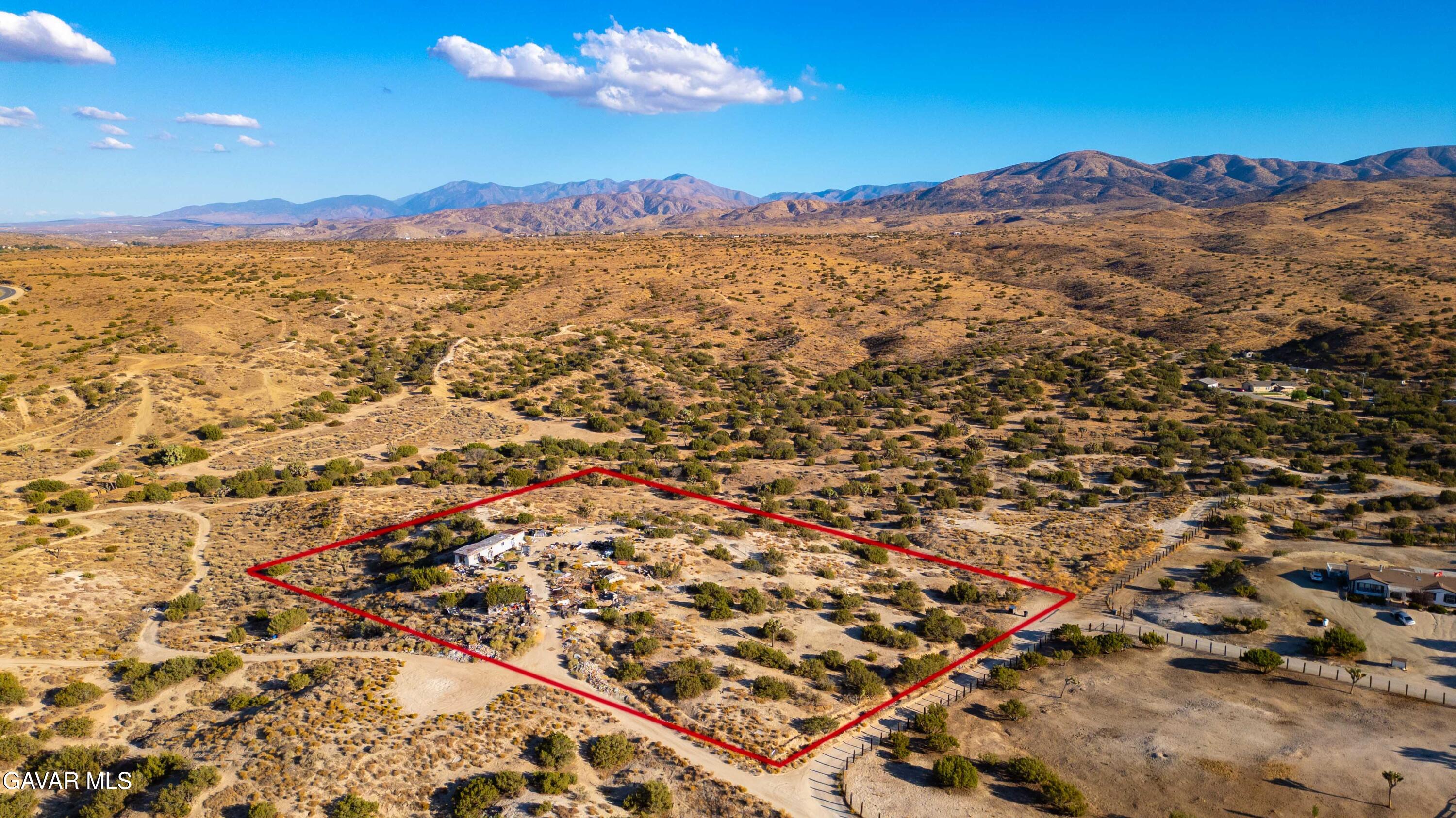 Vic Sme Of Sm Road Palmdale, CA 93550 - Photo 1 of 14 an aerial view of residential houses with outdoor space and mountain view