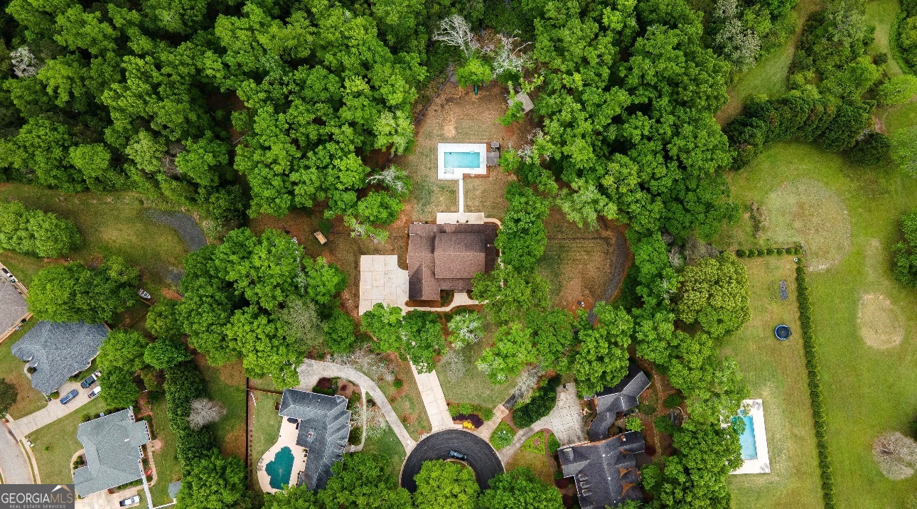 1031 Cherokee Road Perry, GA 31069 - Photo 103 of 104 an aerial view of a house with a yard and large tree