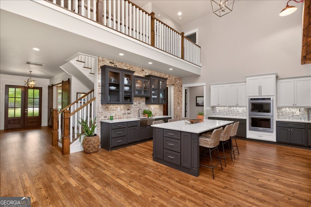 1031 Cherokee Road Perry, GA 31069 - Photo 32 of 104 a living room with stainless steel appliances kitchen island granite countertop lots of wooden furniture a sink and stainless steel appliances