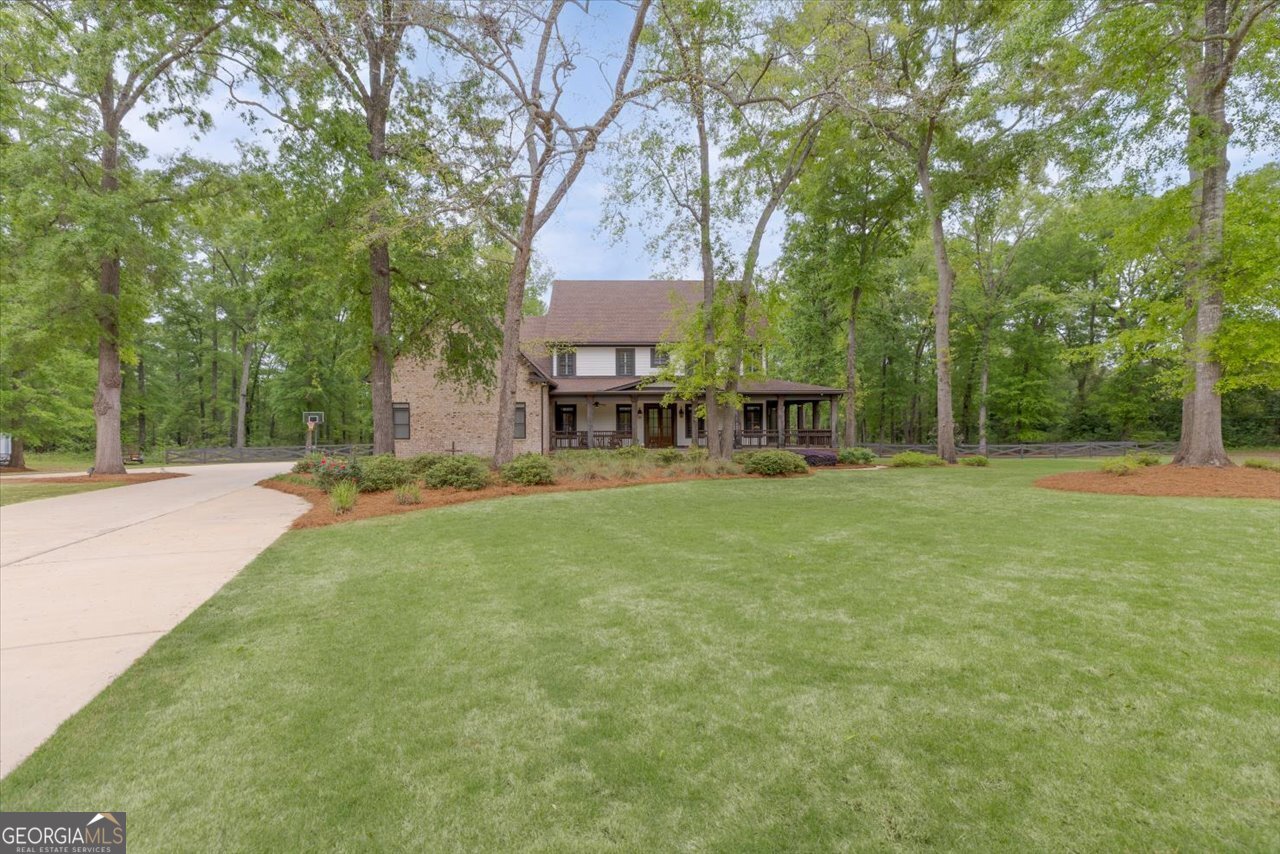 1031 Cherokee Road Perry, GA 31069 - Photo 5 of 104 a view of a house with a backyard