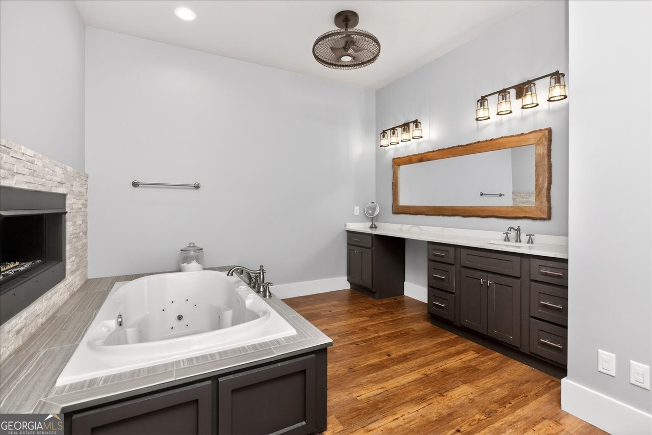 1031 Cherokee Road Perry, GA 31069 - Photo 56 of 104 a bathroom with a sink and a mirror